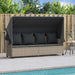 Ligbed met luifel en kussens poly rattan lichtgrijs