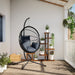 Hangstoel met standaard rattan en staal antracietkleurig